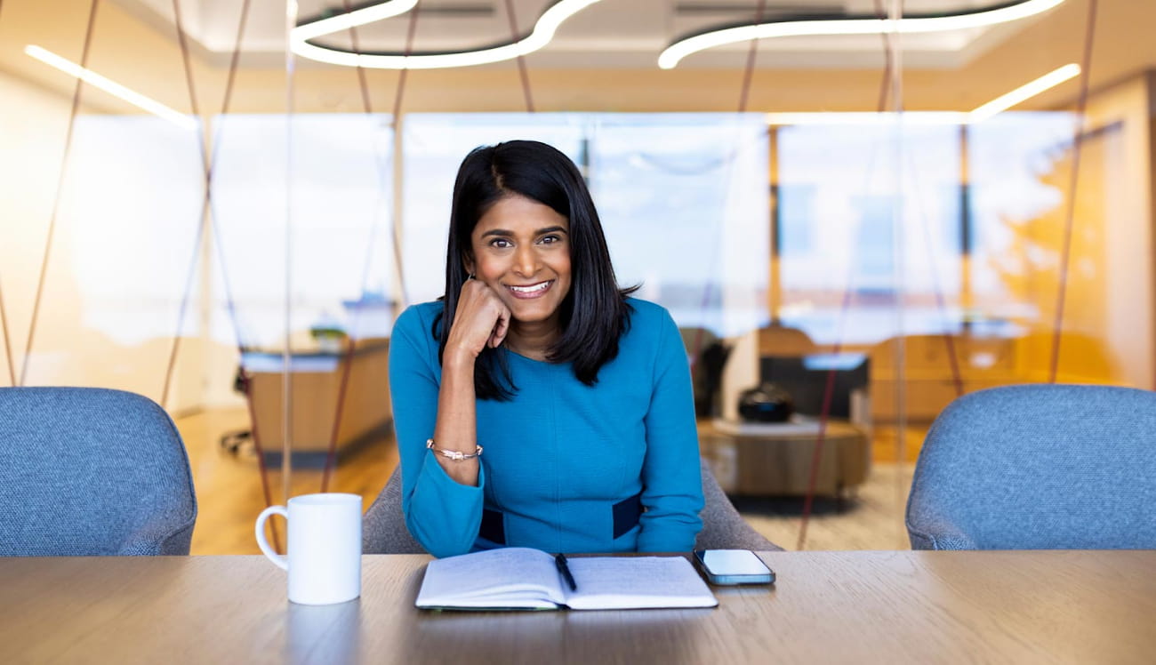 Renee Wittemyer, Senior Director of Program Strategy at Pivotal Ventures, seated in a corporate meeting room.