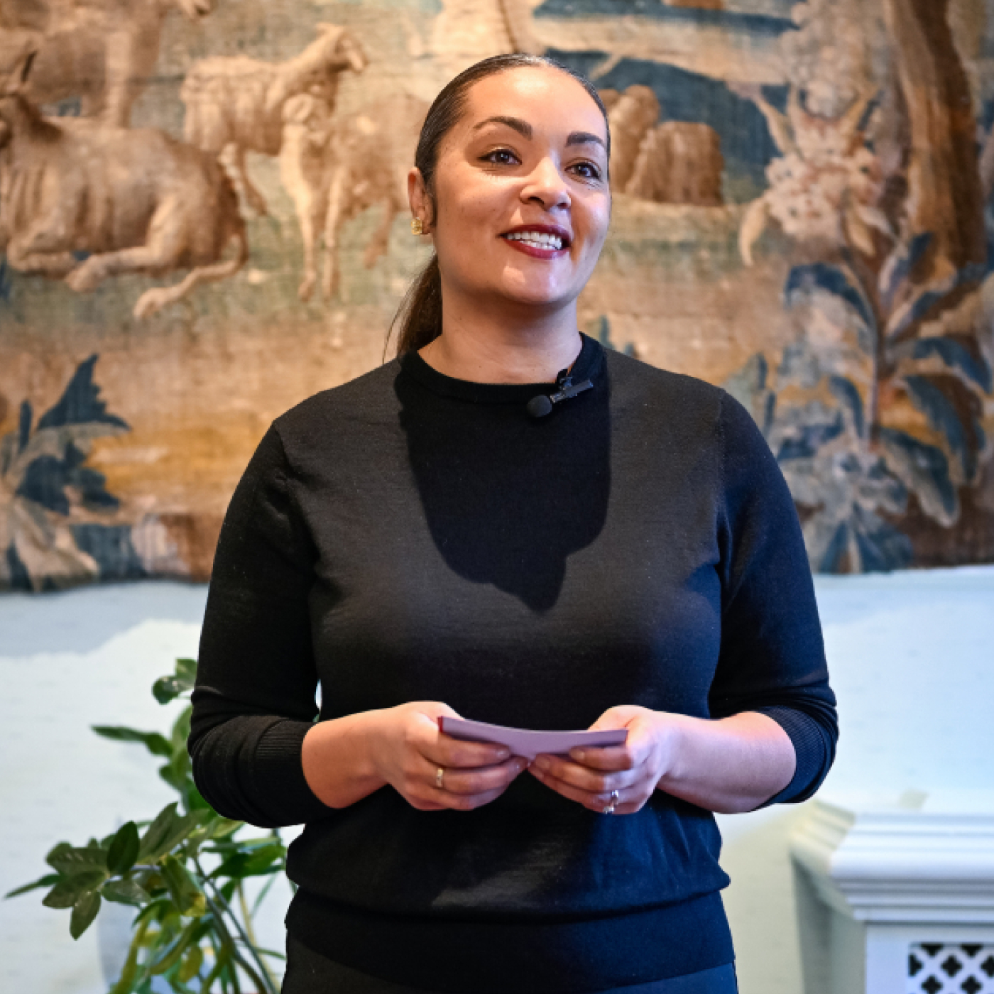 A woman speaking to an audience.