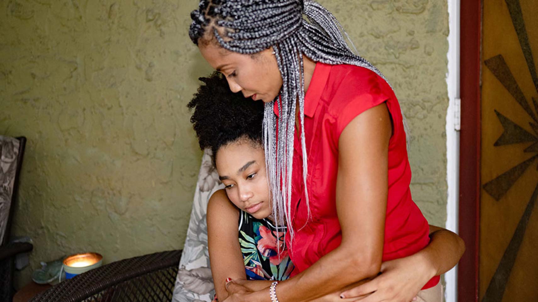 Two people wrap their arms around each other.