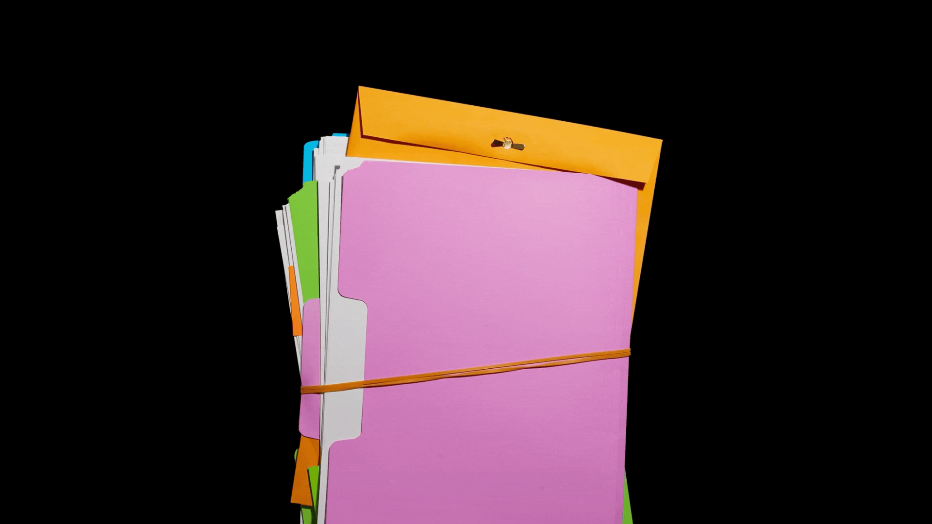 A sheet of paper that reads "How to succeed in office" sits on top of a stack of folders.