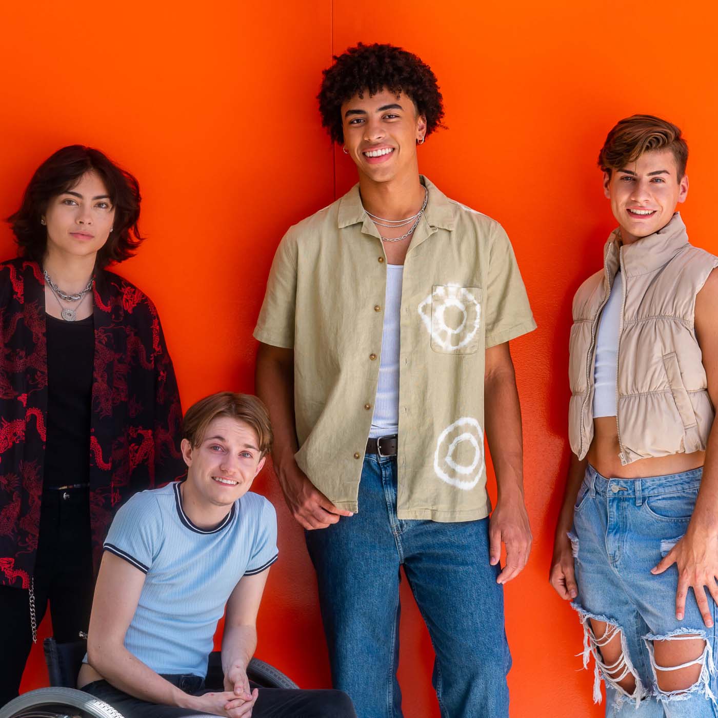 A diverse group of teenagers gathering for a photo together