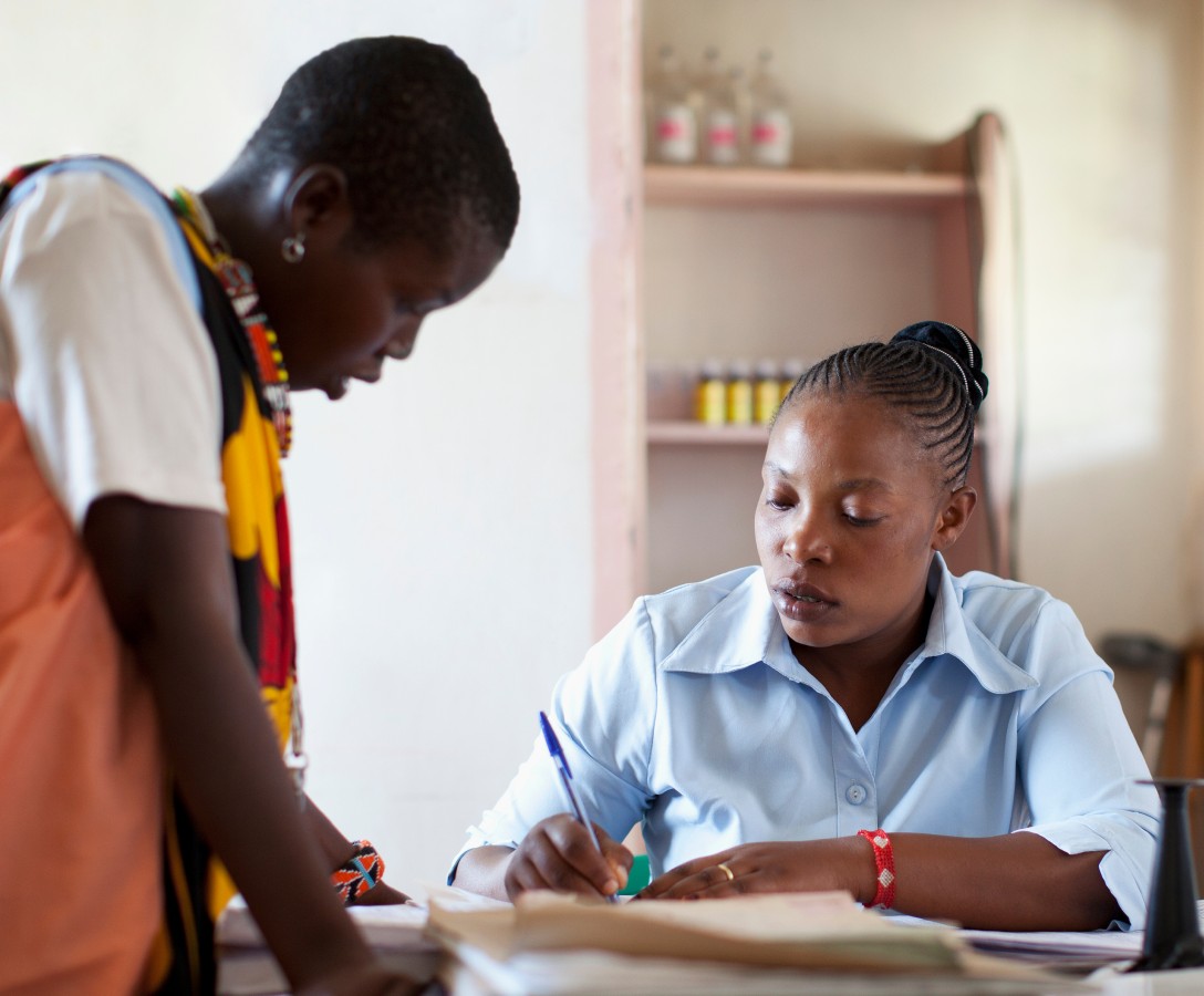 A doctor and patient discuss care at a clinic.