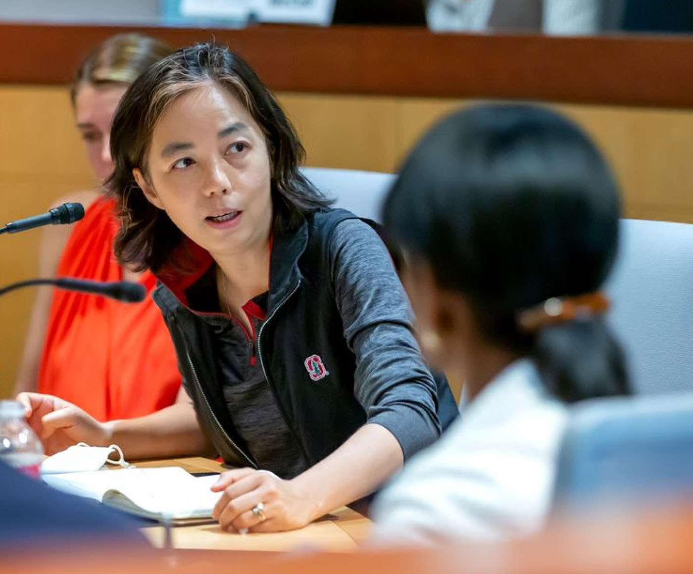 A renowned AI researcher and cofounder speaking to a room of people at an event